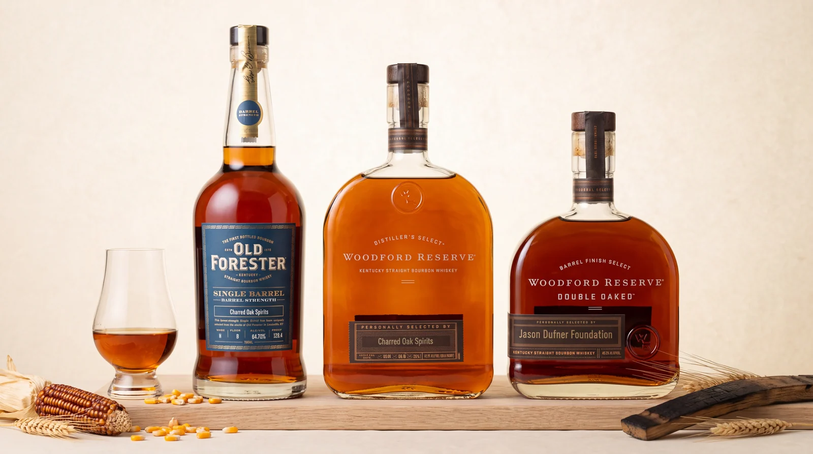 The three Charred Oak barrel picks on an ivory tabletop