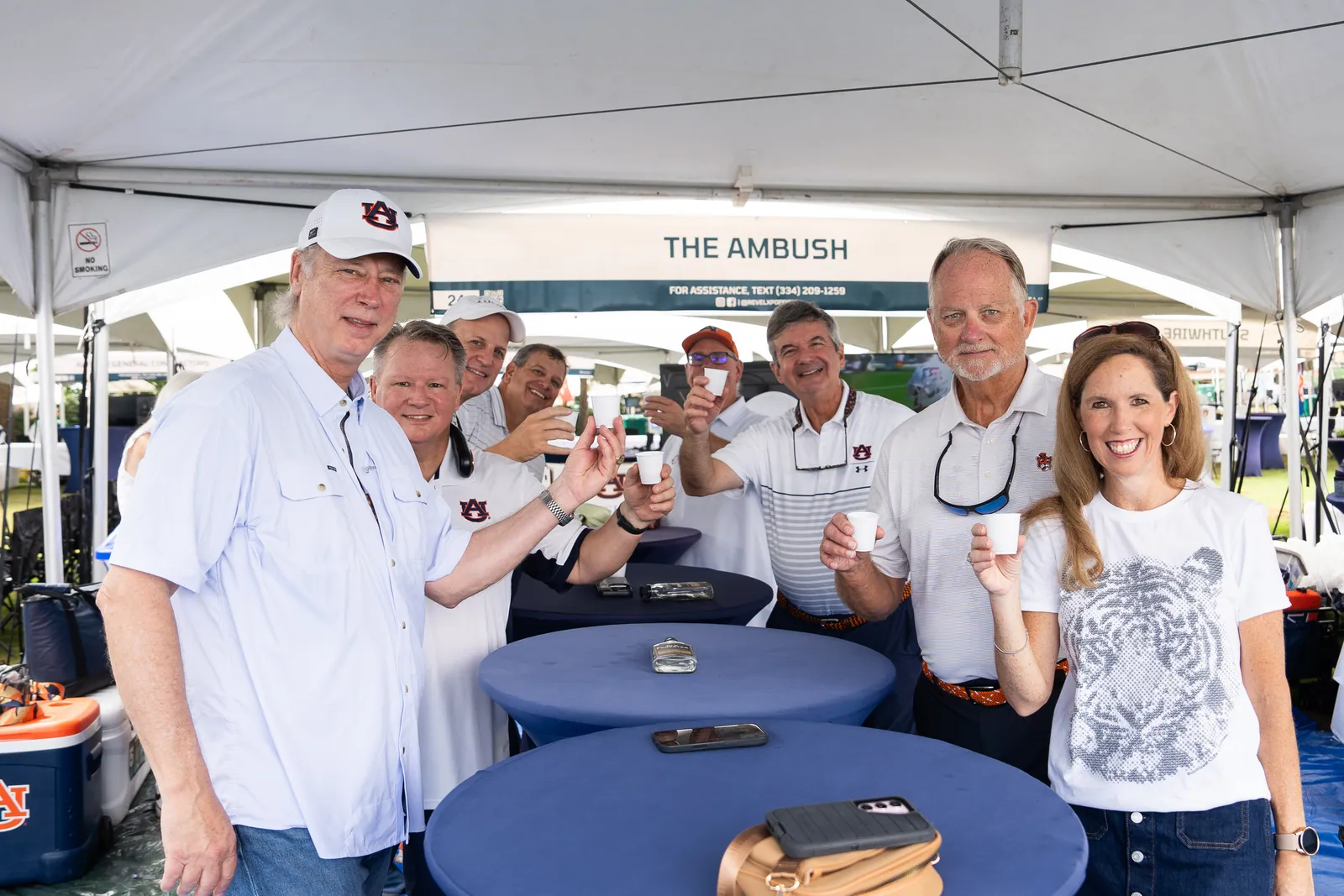 Group toast under the Ambush tent