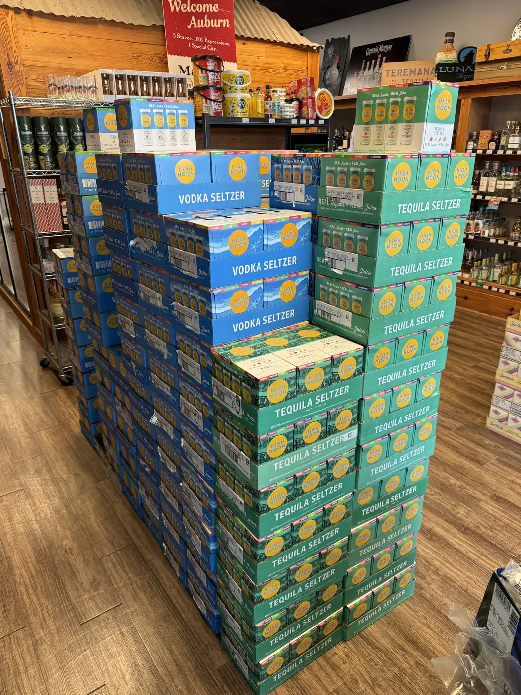 High Noon vodka and tequila seltzer cases stacked on the floor at Charred Oak